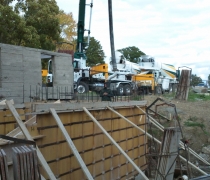pumping concrete into forms for walls