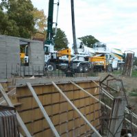 pumping concrete into forms for walls